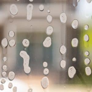 Image of a window being cleaned with detergent