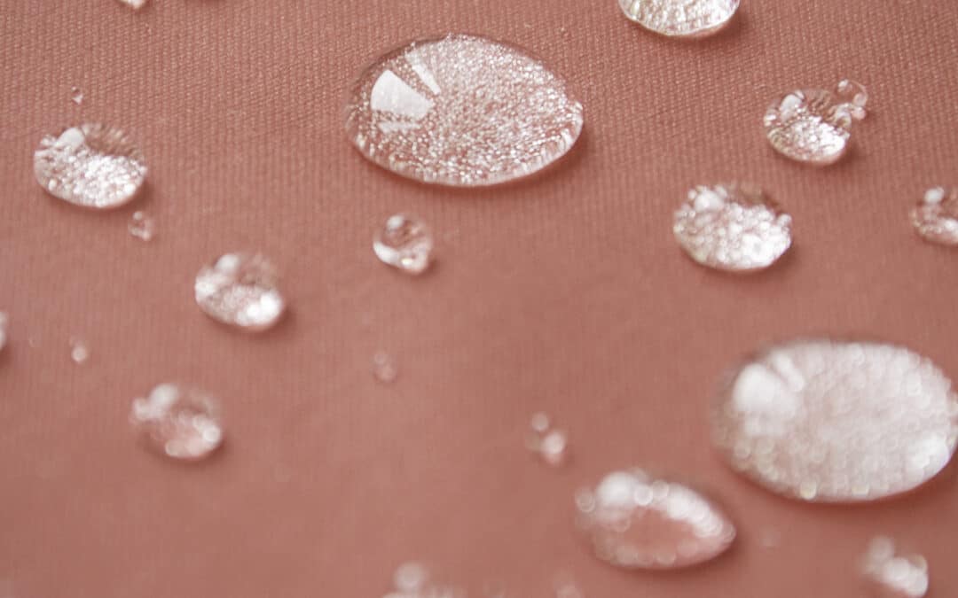 Water droplets on an orange background