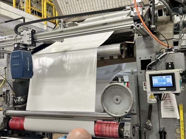 MoistTech IR3000 traversing system installed on an adhesive coating production line.