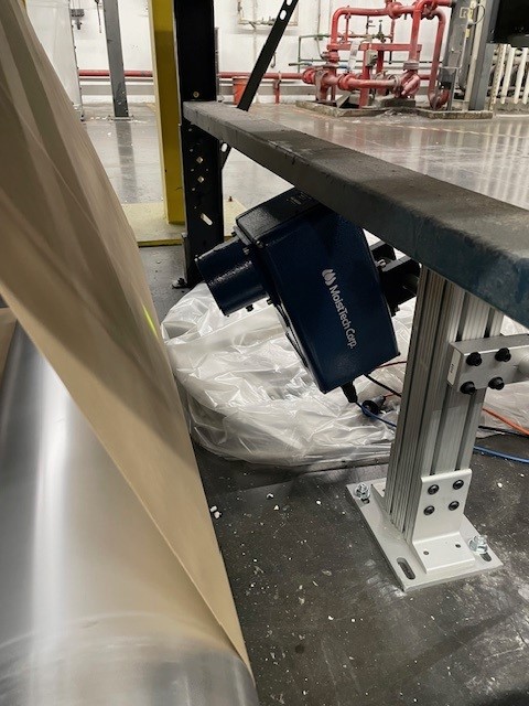 MoistTech moisture sensor installed beside a paper web for real-time measurement