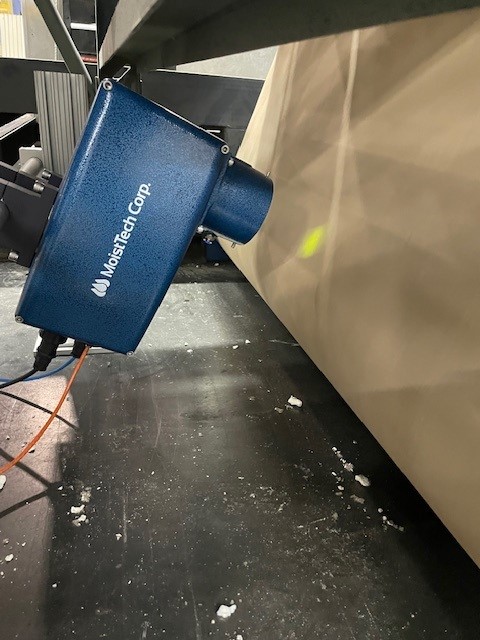 MoistTech NIR sensor measuring moisture on a moving paper web