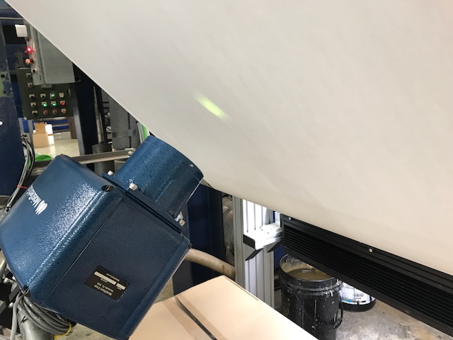 MoistTech IR-3000 sensor measuring moisture on a moving paper web