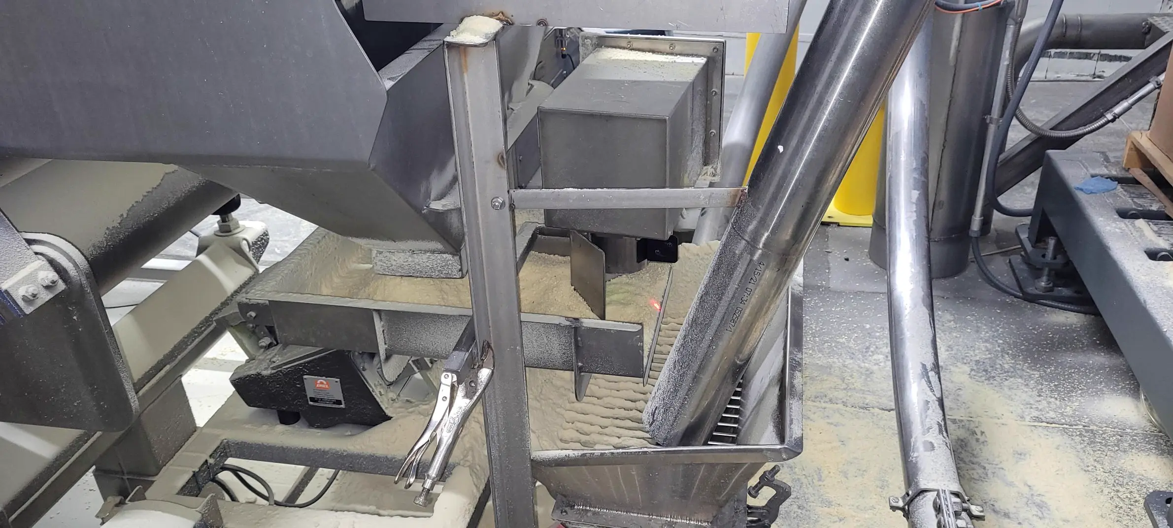 Online moisture sensors measuring potato flakes on production conveyors