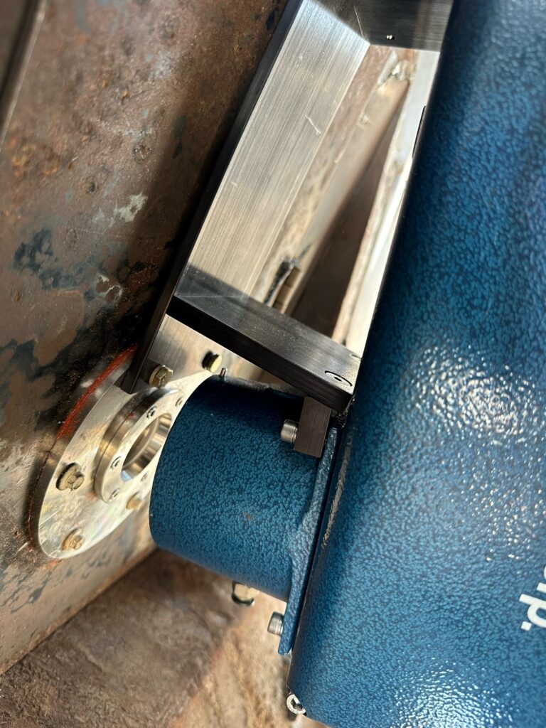 Close-up of MoistTech IR-3000 sensor measurement head on wood processing equipment