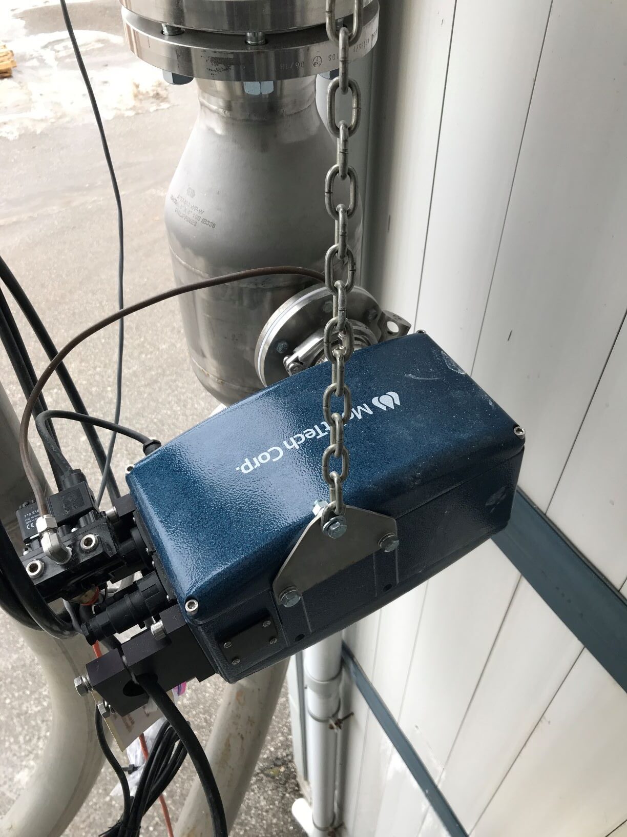 MoistTech IR-3000 NIR moisture sensor installed on an industrial pipeline for plastic powder processing